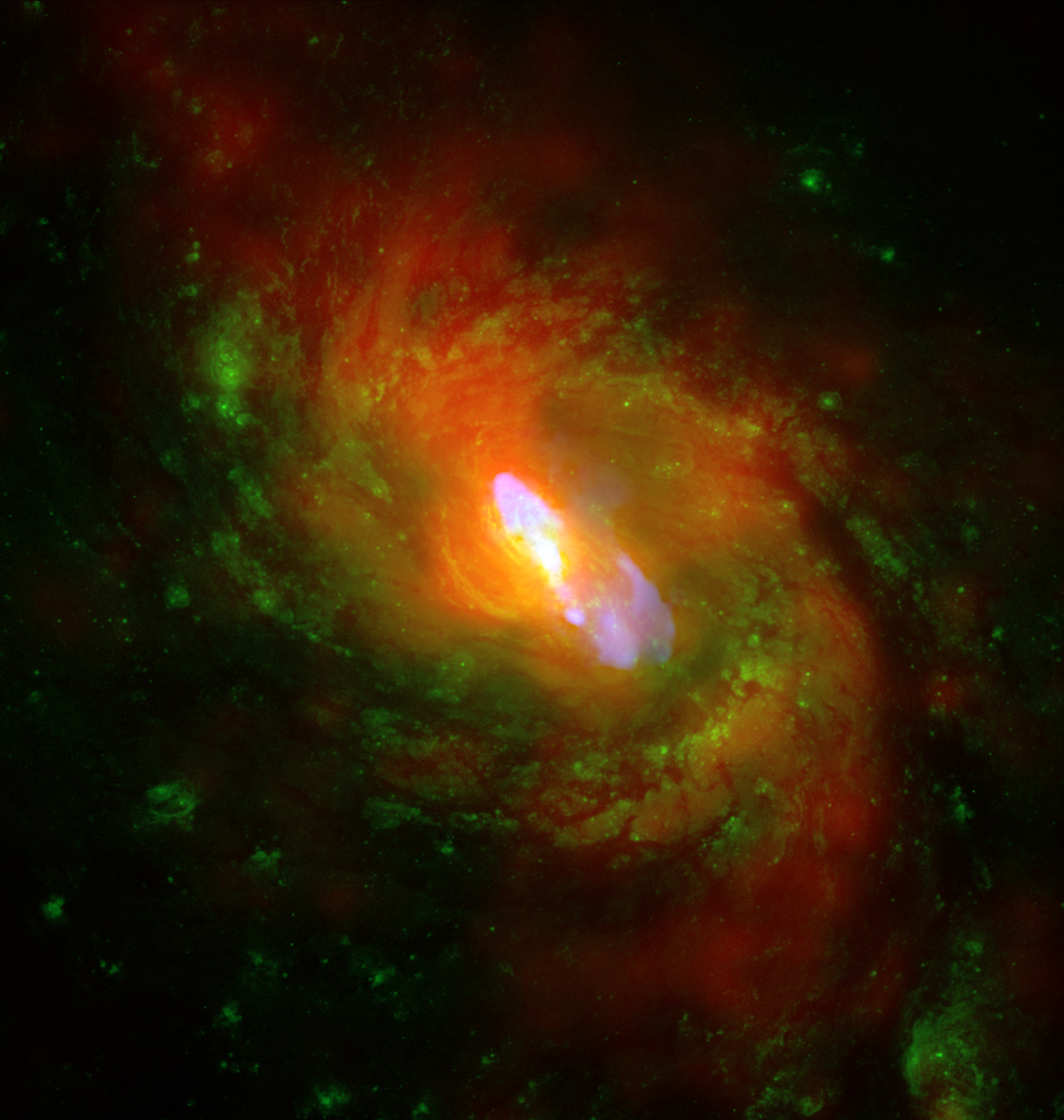 Multiwavelength view of the active galaxy NGC 1068, combining Chandra X-ray, Hubble optical, and VLA radio observations.